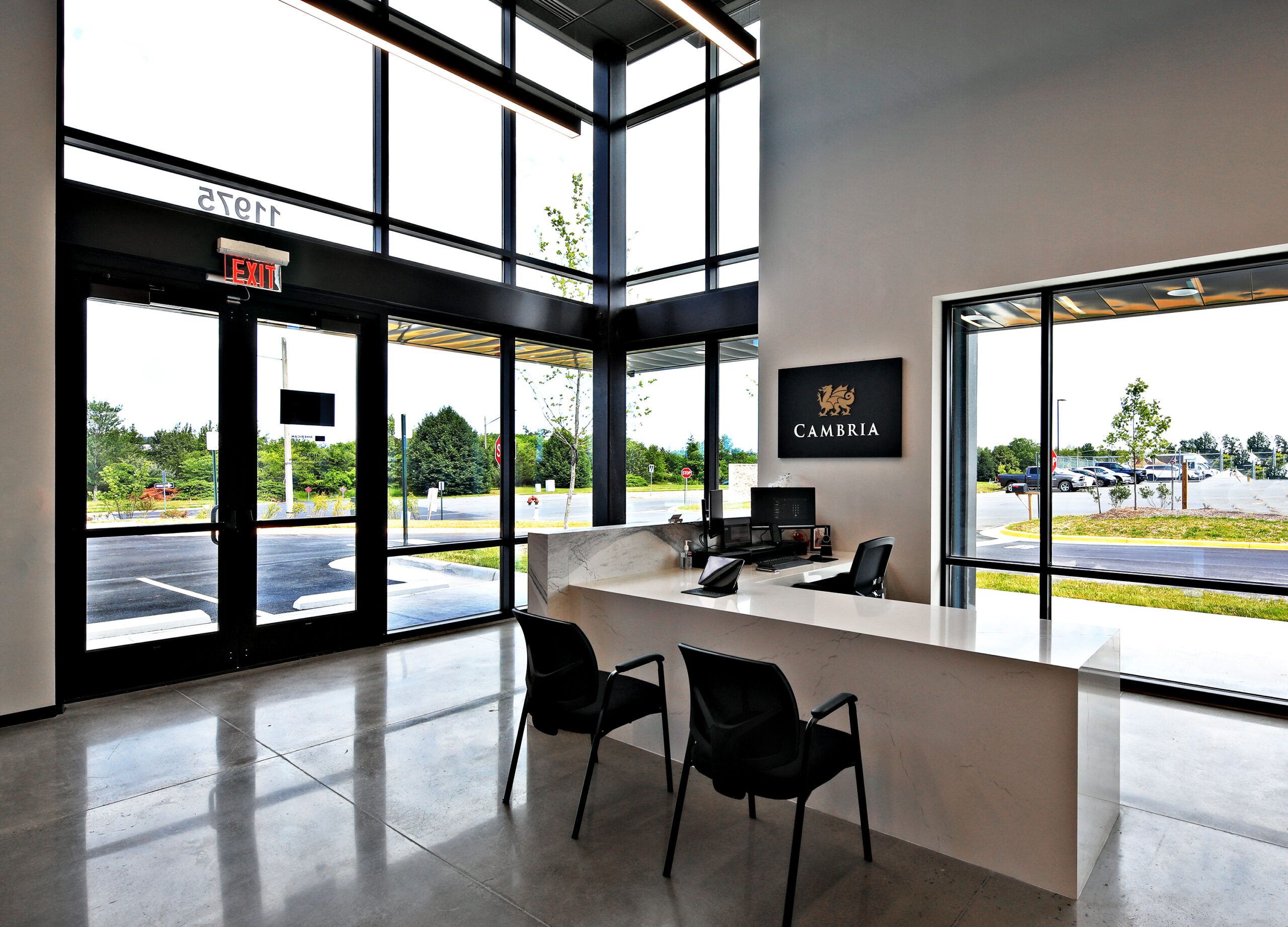cambria-int-8596-061224-lkg-nw-at-the-reception-desk-and-front-entrance
